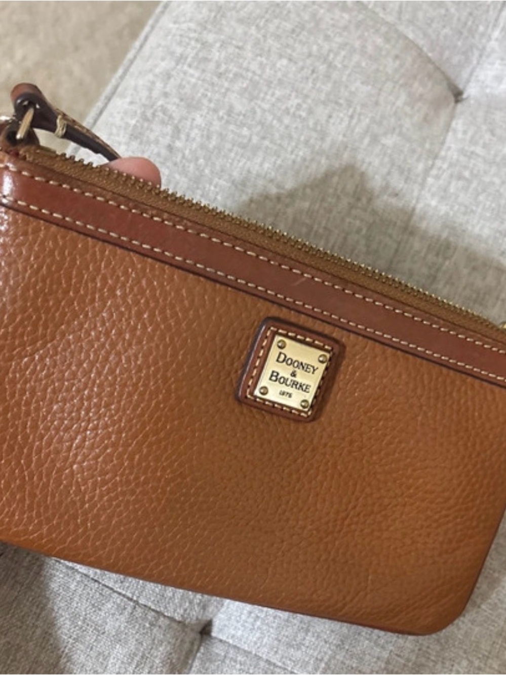 Dooney & Bourke Pebble Leather Wristlet in Cognac Brown with Gold Plaque